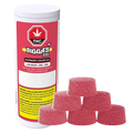 Angled view of a white canister labeled Biggies XXL with raspberry-red "Raspberry Ginger Ale Live Resin Gummies" branding beside a pyramid of six sugar-coated pink gumdrop-style gummies.
