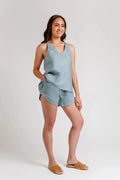 A versatile sewing pattern for a relaxed-fit camisole with a v-neck and crossover yoke, paired with comfy shorts featuring an elastic waist and pockets, perfect for lightweight summer fabrics