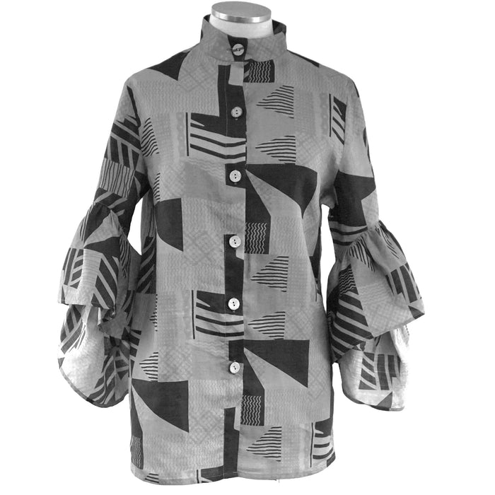 A blue-grey linen ruffle sleeve top with a geometric pattern, displayed on a mannequin.