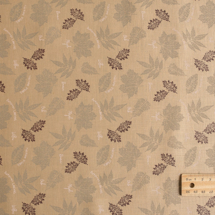 Nature-inspired Sand & Leaves linen fabric with a soft grip and leaf prints, perfect for creating stylish summer garments.