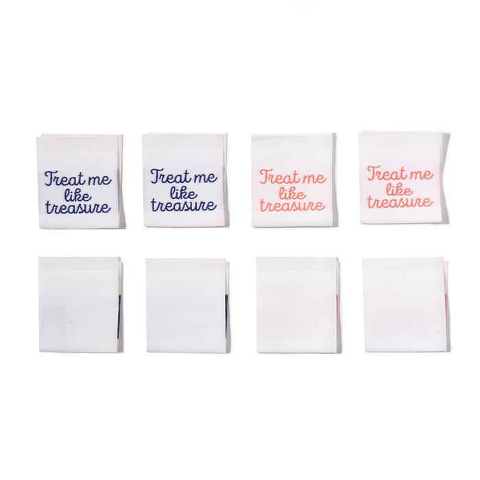 Treat Me Like Treasure sew-in labels with navy and coral text on white, woven polyester labels for handmade garments