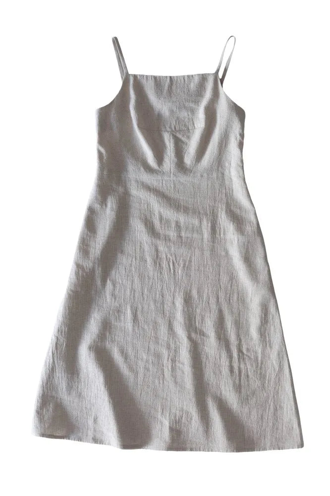 Light gray slip dress on a white background