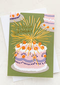 A birthday card with image of cake with candles.