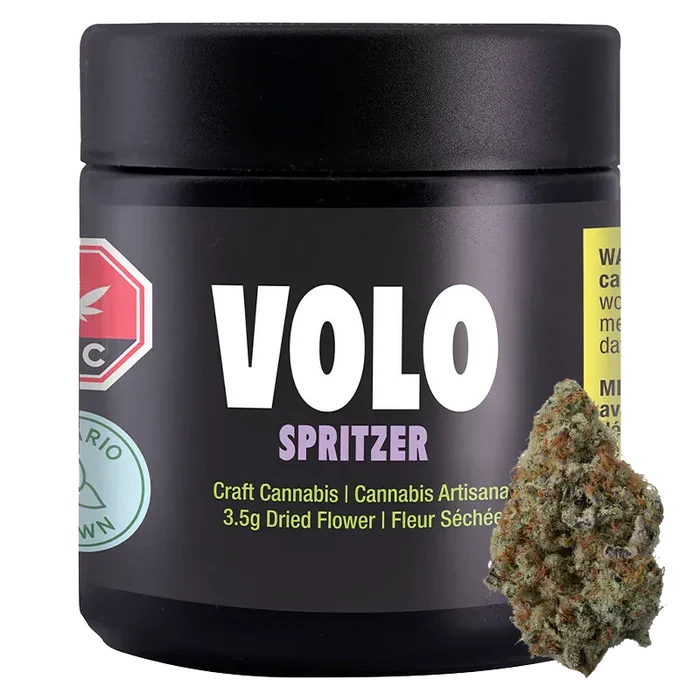 Front-facing shot of the VOLO Spritzer 3.5 g black jar with bold white logo and a cannabis bud leaning against its lower right.