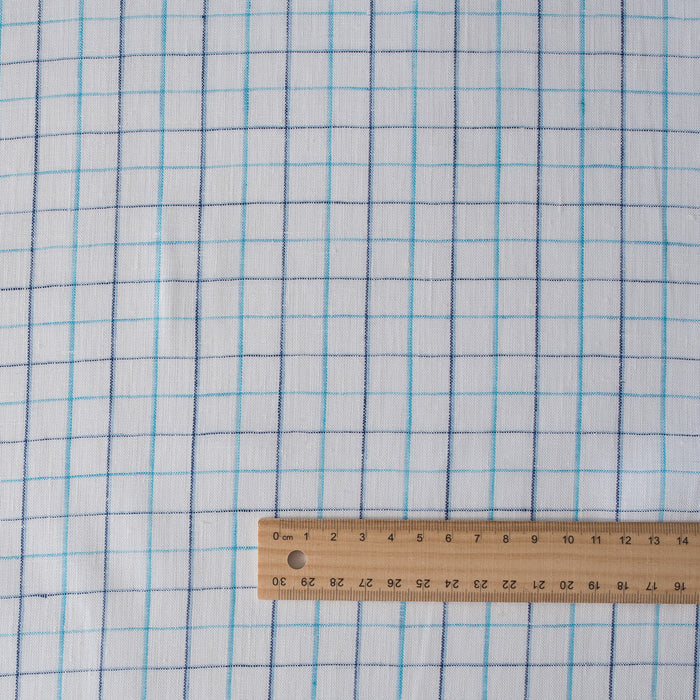 Summer Blues Check 100% Linen Fabric featuring fine blue checks on a white background, ideal for a variety of summer garments