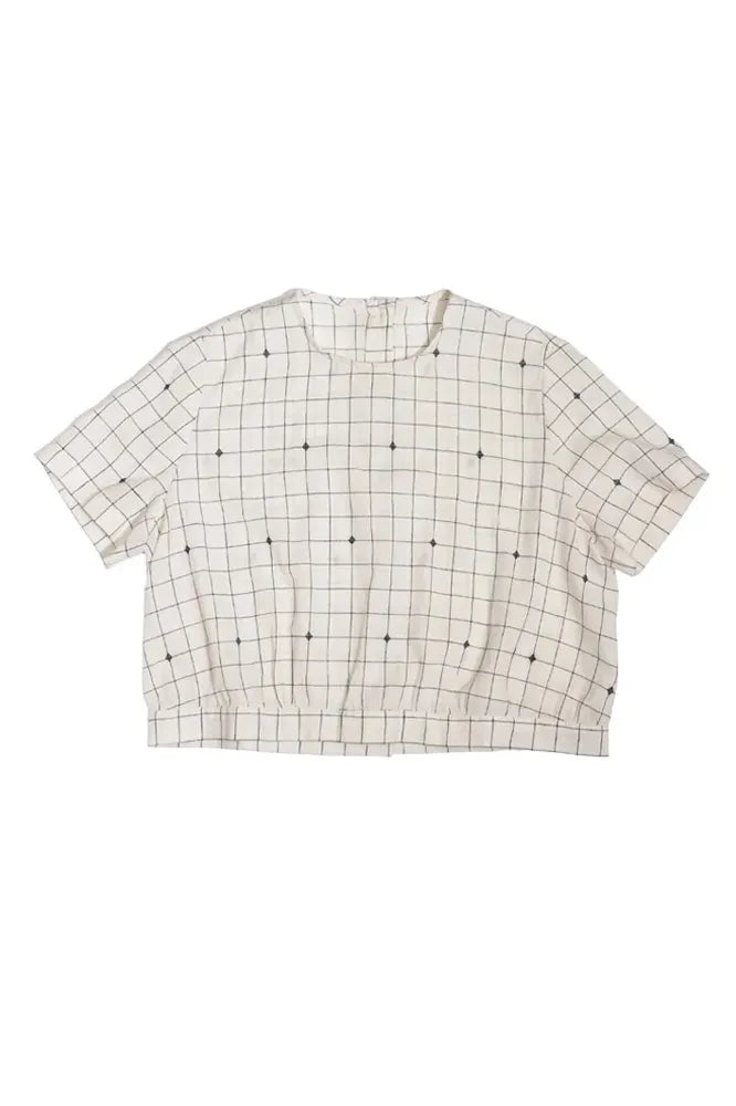 Grid-patterned top made using The Celeste Sewing Pattern by Merchant & Mills – feminine blouse with back buttons and gathered waist
on a white background