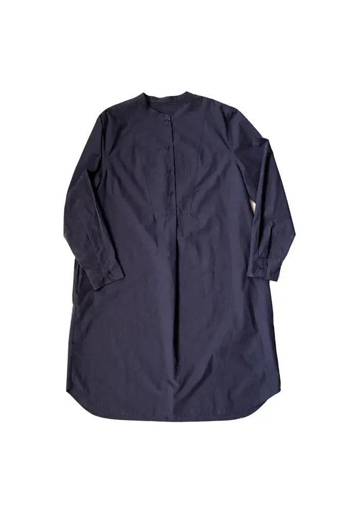 Navy blue dress made using The Niven Sewing Pattern by Merchant & Mills with long sleeves on a white background