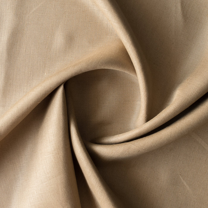 Close-up of Wheatfield Tan is a warm golden 100% linen fabric with folds